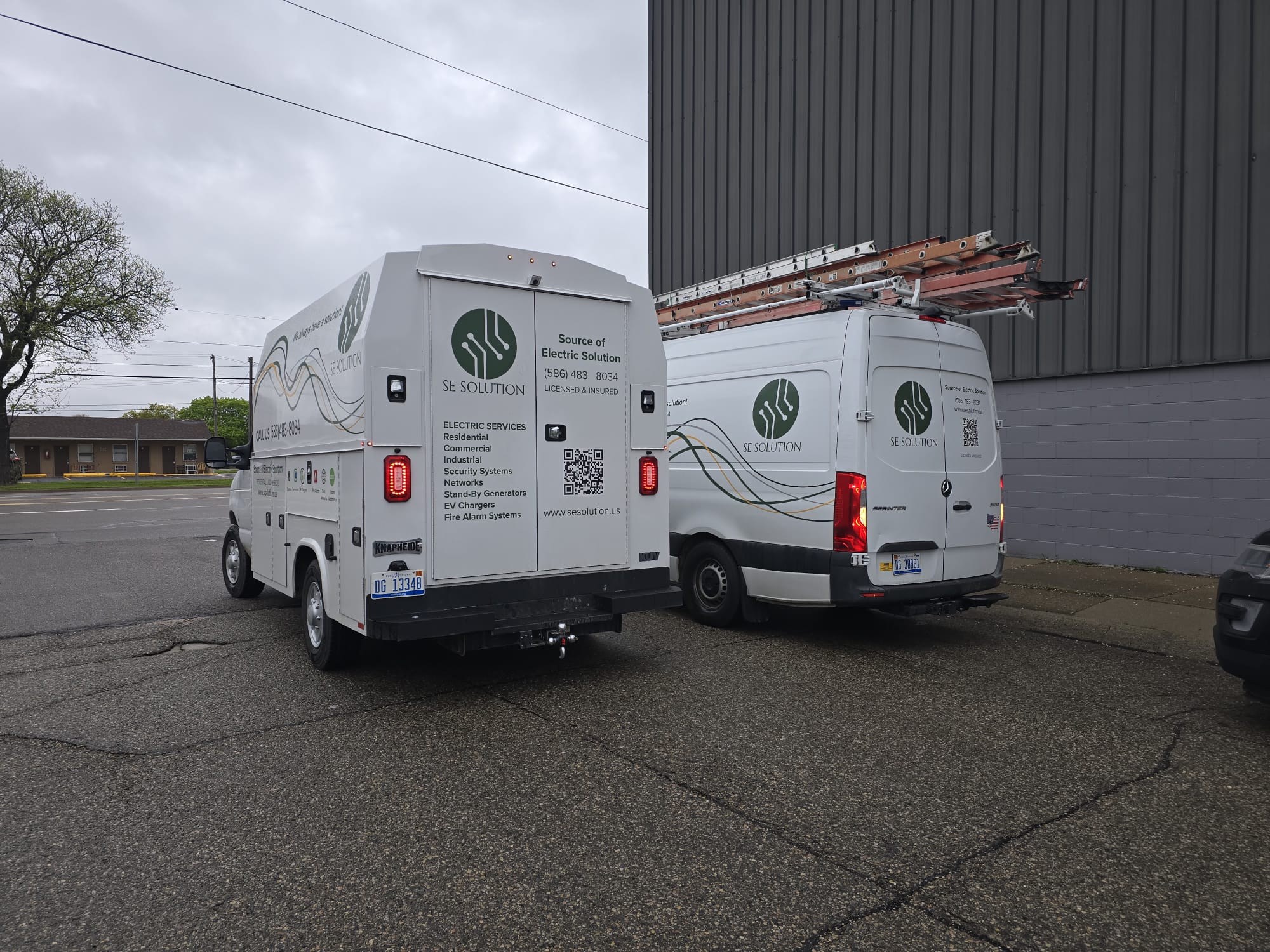 Rear view of SE Solution service truck listing residential, commercial, and industrial electrical services, Metro Detroit, MI