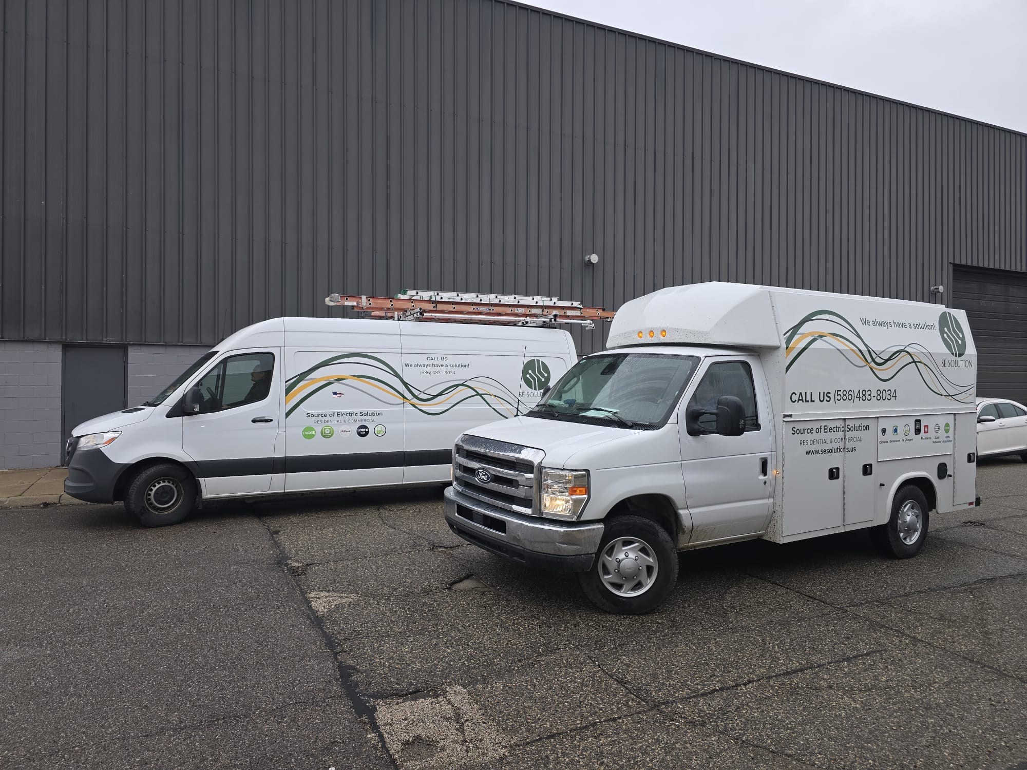 SE Solution branded service vans and truck at company facility