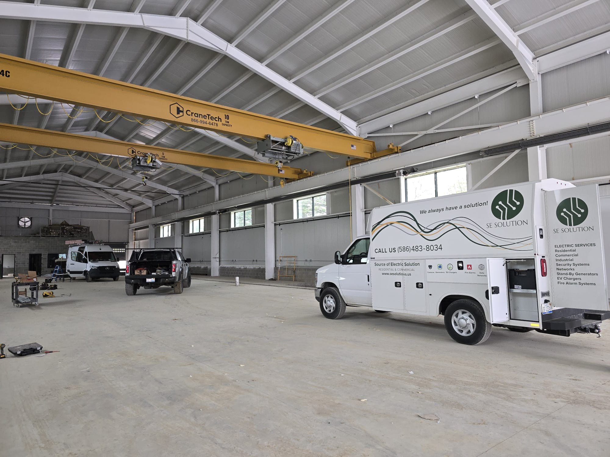 SE Solution service truck inside large industrial facility with CraneTech overhead cranes, Metro Detroit, MI